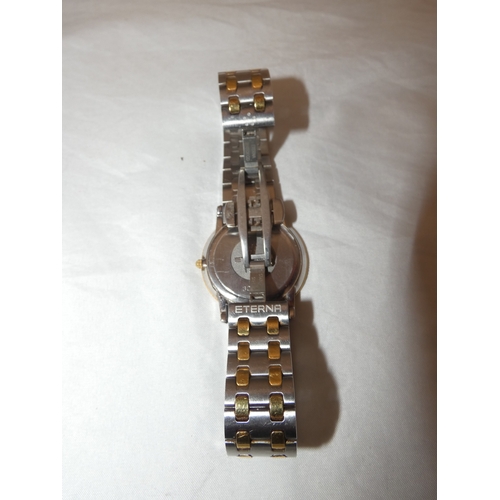 220 - Eterna stainless steel and bi-metal quartz gent's wristwatch, no. 1856.