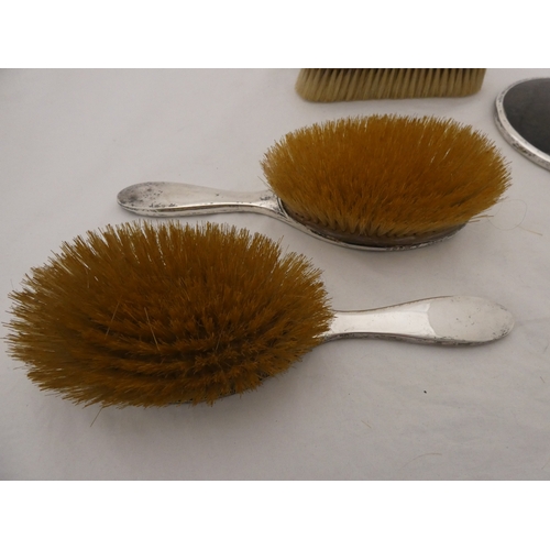 224A - George VI silver and simulated tortoiseshell five-piece brush/mirror set, Birmingham 1946-47.