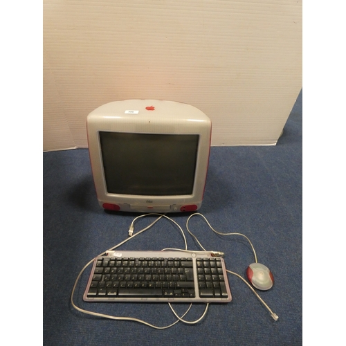 Apple iMac G3, c. 1998, in strawberry, with keyboard, discs