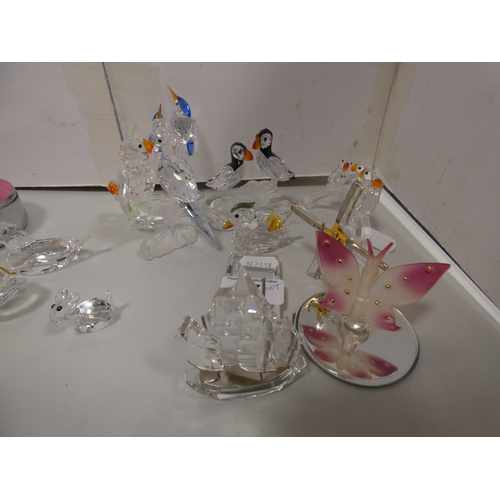 57 - Group of Swarovski and similar glass animal figures to include penguins, birds etc.