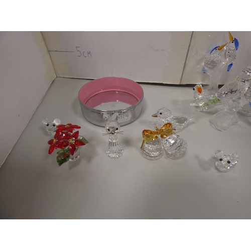 57 - Group of Swarovski and similar glass animal figures to include penguins, birds etc.