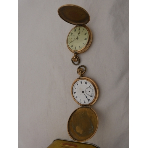 218 - Tin containing watches, jewellery and curios to include two rolled gold full hunter pocket watches, ... 