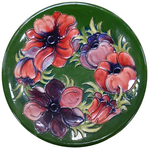 Moorcroft Anemone tube-lined plate, on green ground.