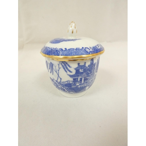 32 - Very rare New Hall sugar box and cover of plain form with flat moulded floral spray finial, blue pri... 