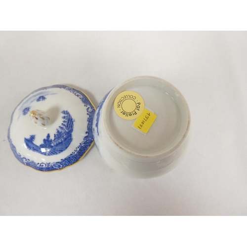 32 - Very rare New Hall sugar box and cover of plain form with flat moulded floral spray finial, blue pri... 