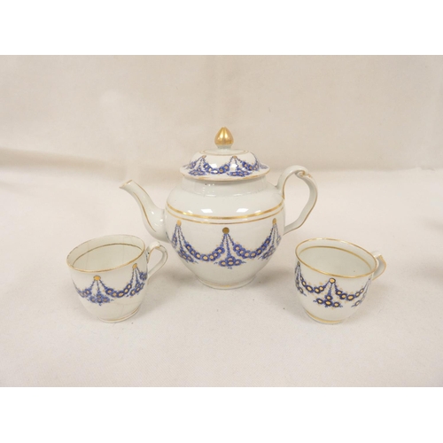 38 - New Hall teapot of spherical form with clip handle, pattern U23, blue and gilt swags, impact damage ... 