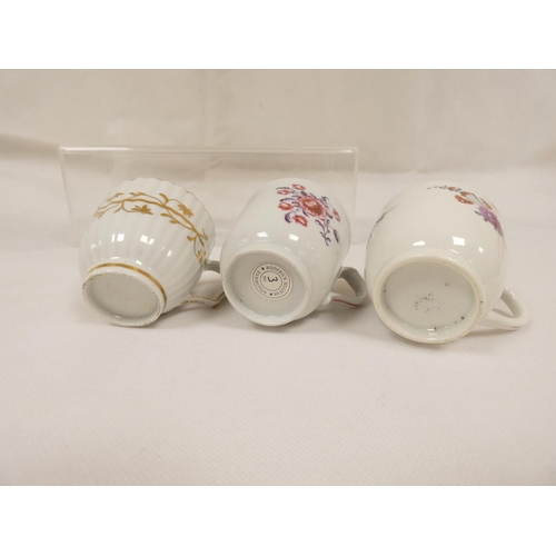 41 - New Hall coffee cup of very rare ribbed form with unusual shaped handle, gilt line and trailing foli... 