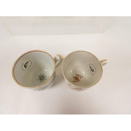 41 - New Hall coffee cup of very rare ribbed form with unusual shaped handle, gilt line and trailing foli... 