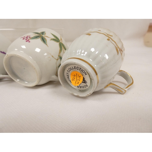 42 - New Hall coffee cup of very rare ribbed form with unusual shaped handle, gilt line and trailing foli... 