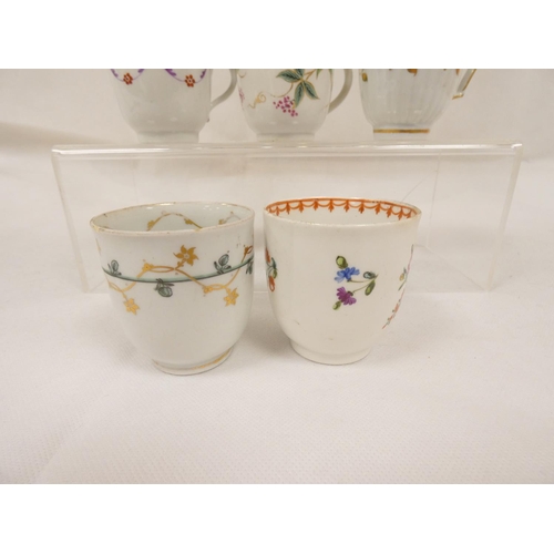 42 - New Hall coffee cup of very rare ribbed form with unusual shaped handle, gilt line and trailing foli... 