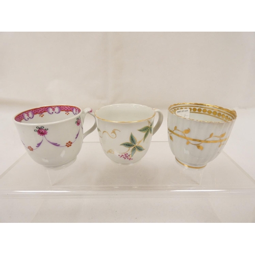 42 - New Hall coffee cup of very rare ribbed form with unusual shaped handle, gilt line and trailing foli... 