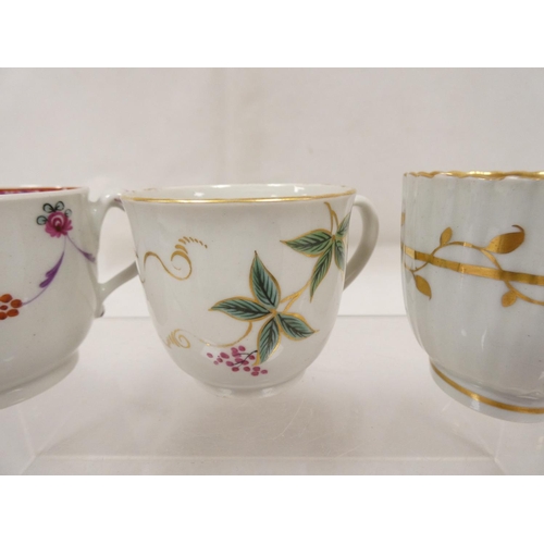 42 - New Hall coffee cup of very rare ribbed form with unusual shaped handle, gilt line and trailing foli... 