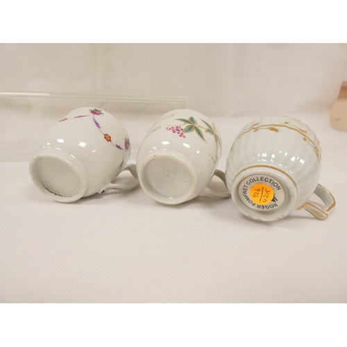 42 - New Hall coffee cup of very rare ribbed form with unusual shaped handle, gilt line and trailing foli... 