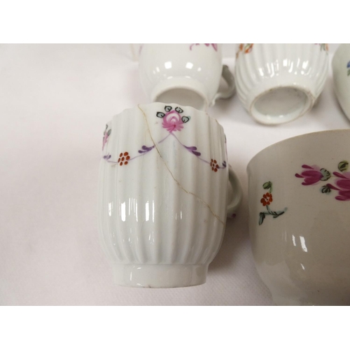 43 - Rare early New Hall coffee cup of corrugated form with double scroll handle, floral sprays with knit... 