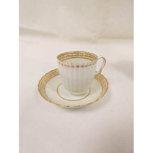 56 - Possibly New Hall teawares of reeded form with gilt band decoration, comprising coffee cup and sauce... 