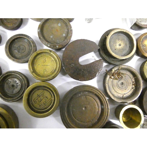 156 - Large collection of George III brass and bronze weights to include bank weights.