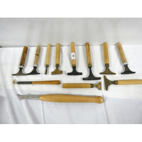 95 - Twelve various book binding irons.