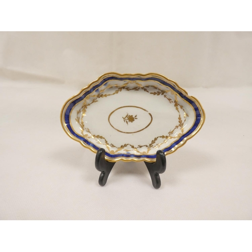 60 - New Hall small butter boat, rare form low lobed body with clip handle, floral spray decoration, pink... 