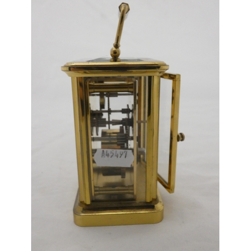 100 - Four glass carriage clock, marked Woodford to the white dial.