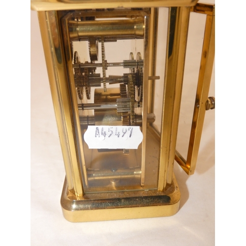 100 - Four glass carriage clock, marked Woodford to the white dial.