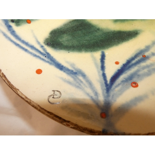 103 - Spanish majolica shallow dish by Puigdemont decorated with a profile of a carp to the well.