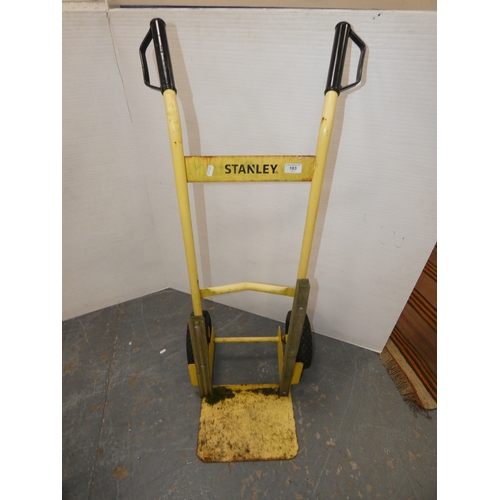 183 - Stanley painted yellow metal sack barrow.
