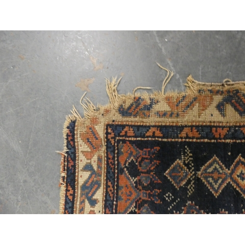 186 - Persian hand-knotted tribal rug and a Persian Sarouk rug (both have tears and wear).&nbsp; (2)