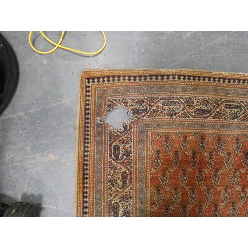 186 - Persian hand-knotted tribal rug and a Persian Sarouk rug (both have tears and wear).&nbsp; (2)