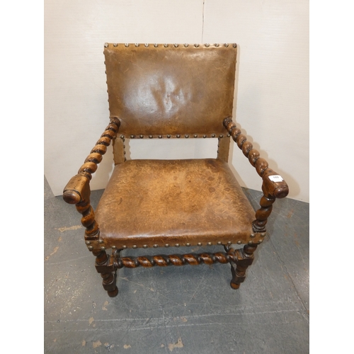 189 - Antique walnut barley column open armchair with studded hide back rest and seat.