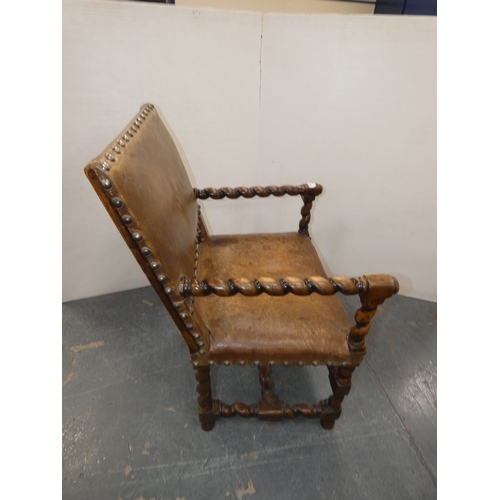 189 - Antique walnut barley column open armchair with studded hide back rest and seat.