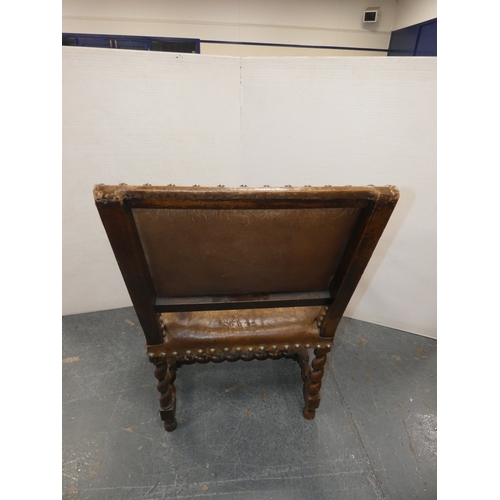 189 - Antique walnut barley column open armchair with studded hide back rest and seat.