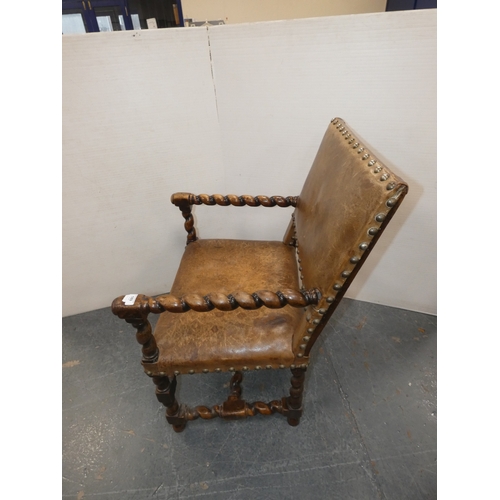 189 - Antique walnut barley column open armchair with studded hide back rest and seat.