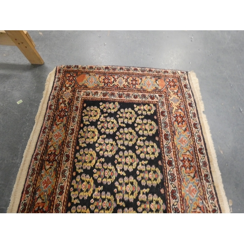 192 - Small Persian Heriz hand-knotted rug.