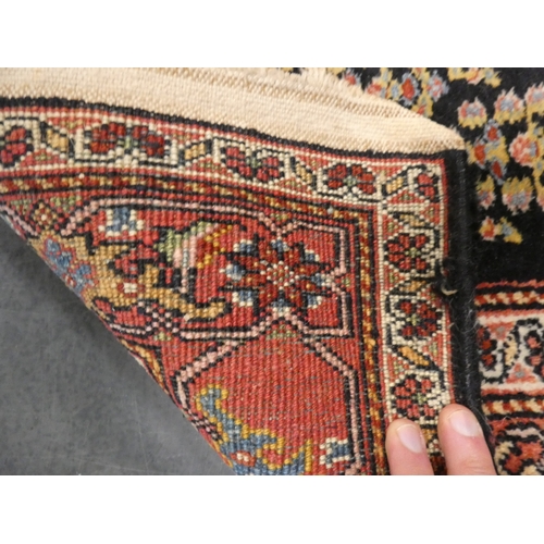 192 - Small Persian Heriz hand-knotted rug.