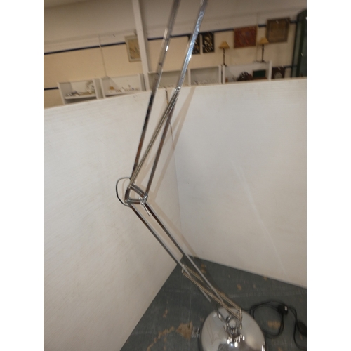 195 - Modern chrome-effect angle poise floor lamp.