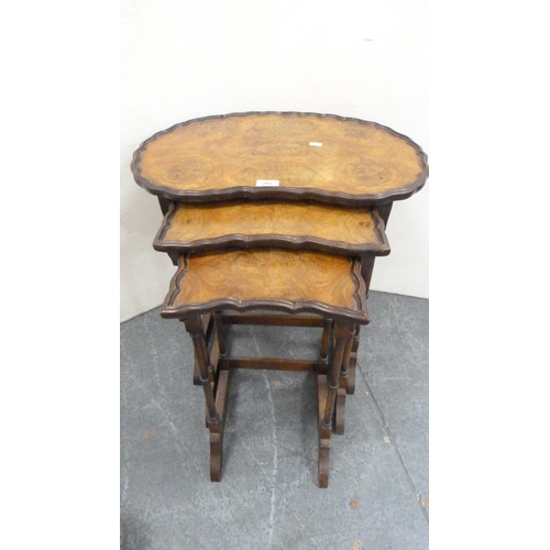 203 - Walnut nest of three tables and a floral upholstered stool.