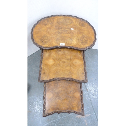 203 - Walnut nest of three tables and a floral upholstered stool.