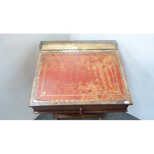 214 - Victorian mahogany davenport with brass gallery rail and animal paw feet.