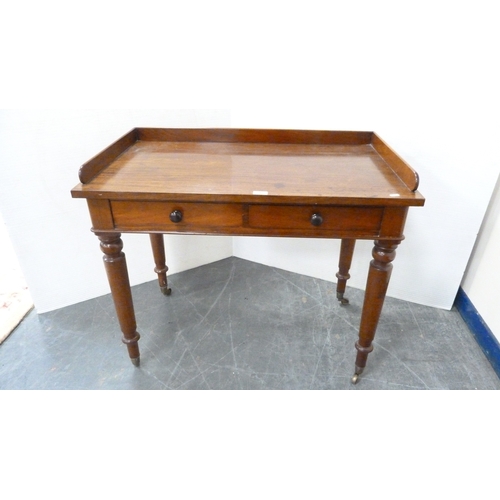 215 - Victorian mahogany two-drawer writing desk with three-quarter gallery.