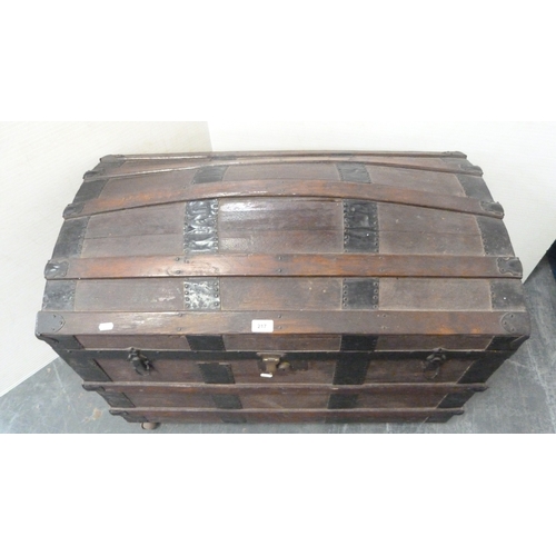 217 - Wood-bound domed travel trunk.