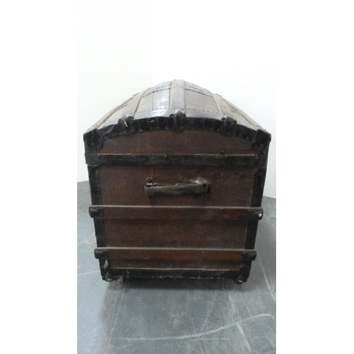 217 - Wood-bound domed travel trunk.