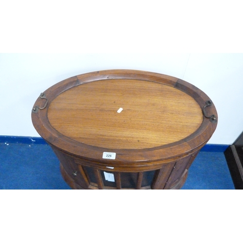 226 - Indonesian reproduction oval drinks cabinet with serving tray top.
