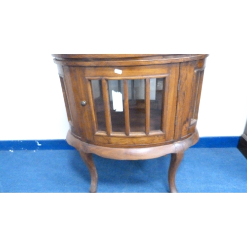 226 - Indonesian reproduction oval drinks cabinet with serving tray top.