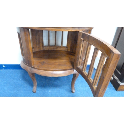 226 - Indonesian reproduction oval drinks cabinet with serving tray top.