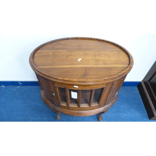 226 - Indonesian reproduction oval drinks cabinet with serving tray top.