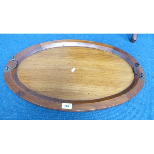 226 - Indonesian reproduction oval drinks cabinet with serving tray top.