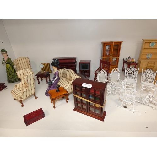 64 - Collection of doll's house furniture to include a rolltop desk, dressers, display cabinet, stove, ta... 