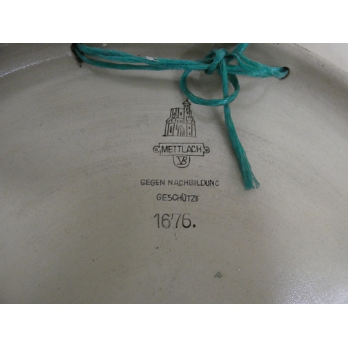 230 - Large Mettlach wall charger decorated with birds and insects in a naturalistic setting (a/f).