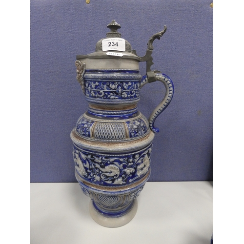 234 - Large German salt glazed jug with pewter cover and two steins.