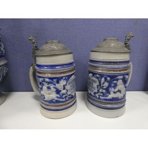 234 - Large German salt glazed jug with pewter cover and two steins.